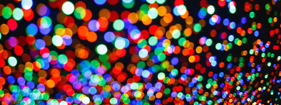 An abstract header image showing out-of-focus colorful bokeh lights, which represent the simplified data points on a dense, interactive map. helps declutter the view for a better user experience.